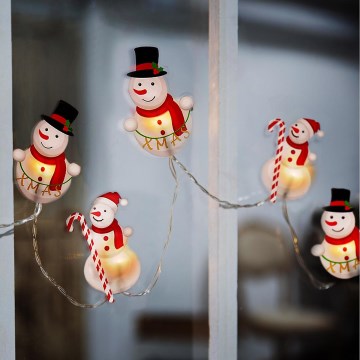 Catena luminosa LED con ventose 6xLED/2xAA 1,2m bianco caldo motivo pupazzo di neve